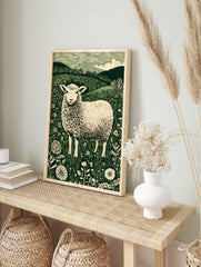 Illustrative green and white sheep in a field of flowers with hills and trees in background, in an alternate framed mockup