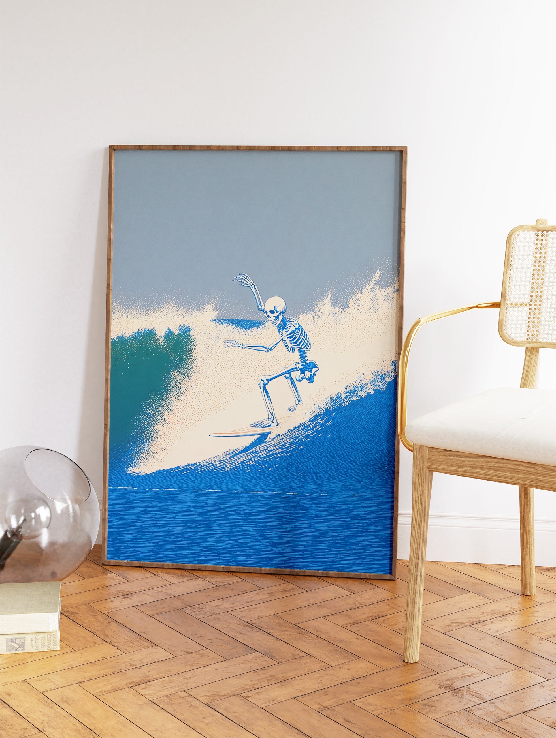 Skeleton surfer riding a blue ocean wave art print, with stippled texture for water and sky, vibrant coastal scene. - Image 2