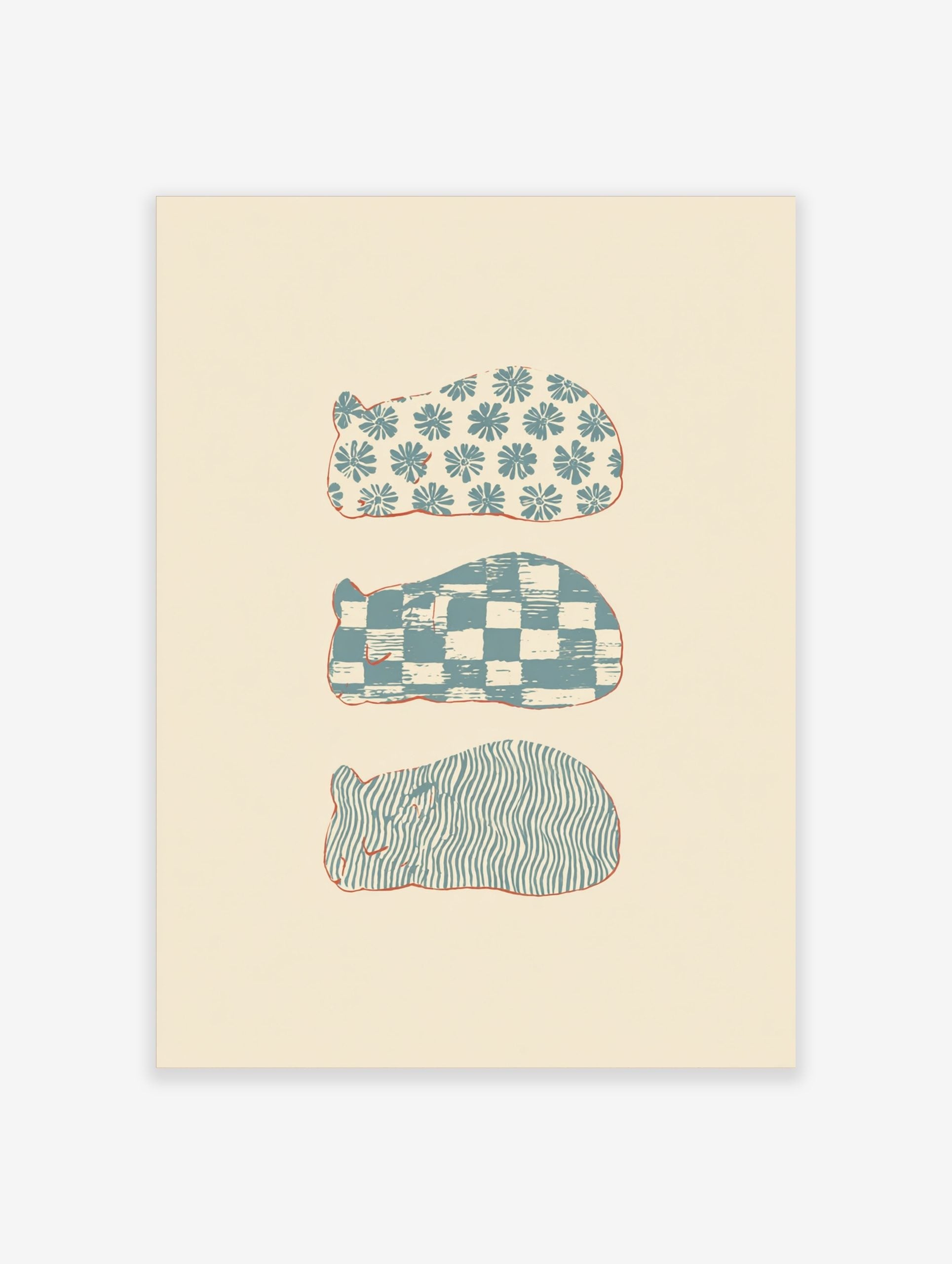 Three stylised sleeping animal shapes with blue floral, checkerboard, and wavy patterns on a cream background