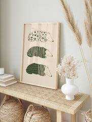 Three illustrative sleeping badger-like animals with botanical, striped, and grid patterns on, in an alternate framed mockup