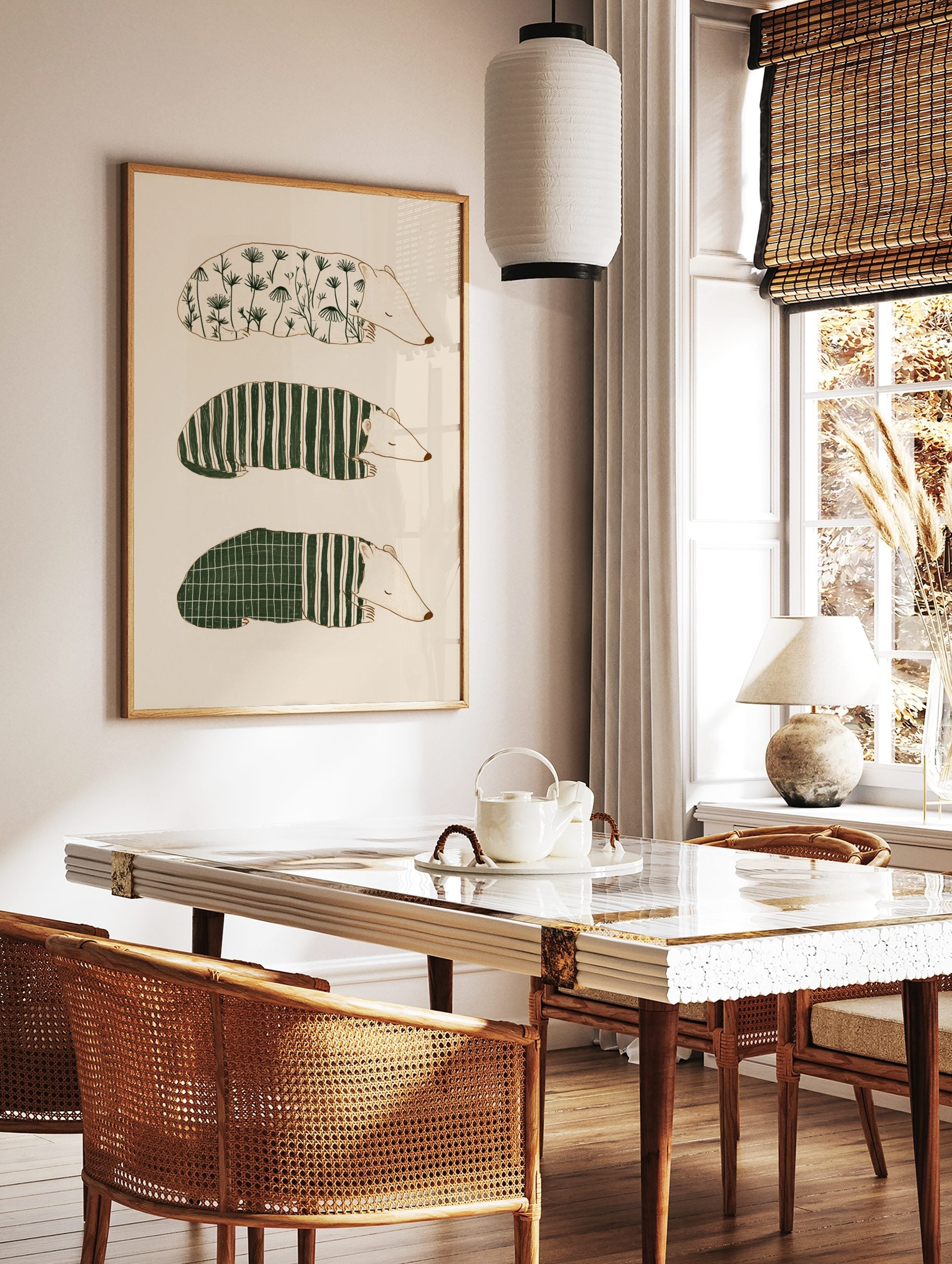 Three illustrative sleeping badger-like animals with botanical, striped, and grid patterns on a, in a styled room mockup