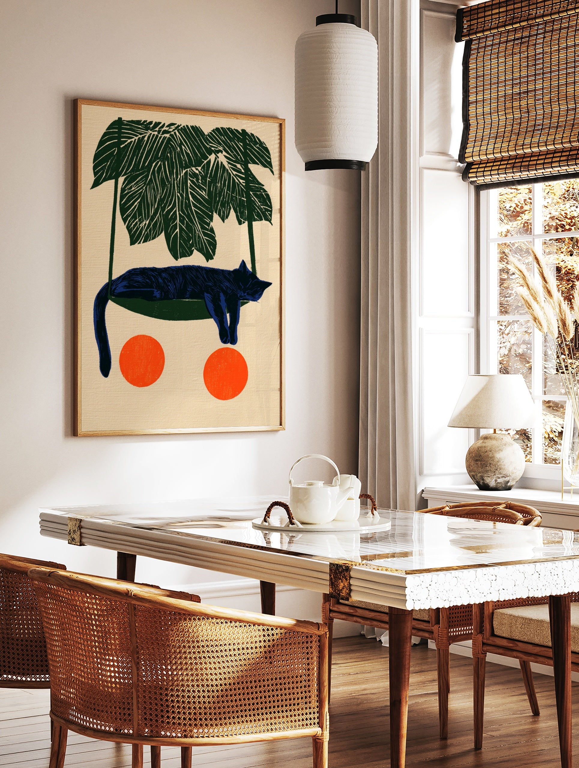 Illustrative blue cat sleeping in a green hammock under palm leaves with two orange circles on a, in a styled room mockup