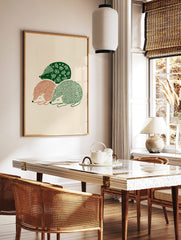 Three sleeping hedgehogs in green and terracotta folk art illustration on a beige background, in a styled room mockup