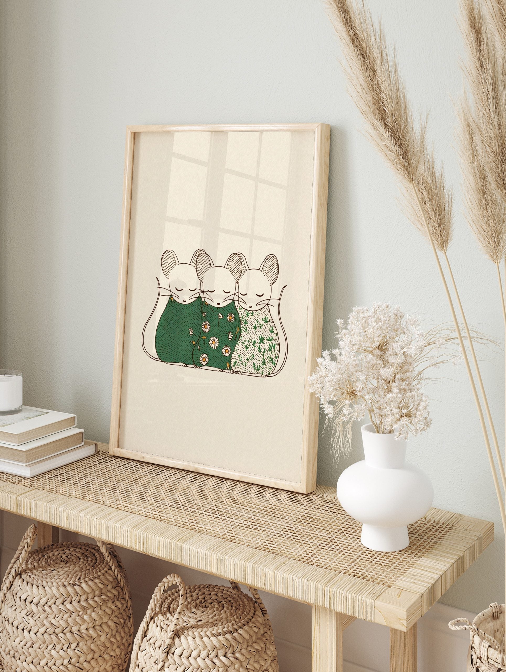 Three illustrative sleeping mice in patterned green coverings on a light beige background, in an alternate framed mockup