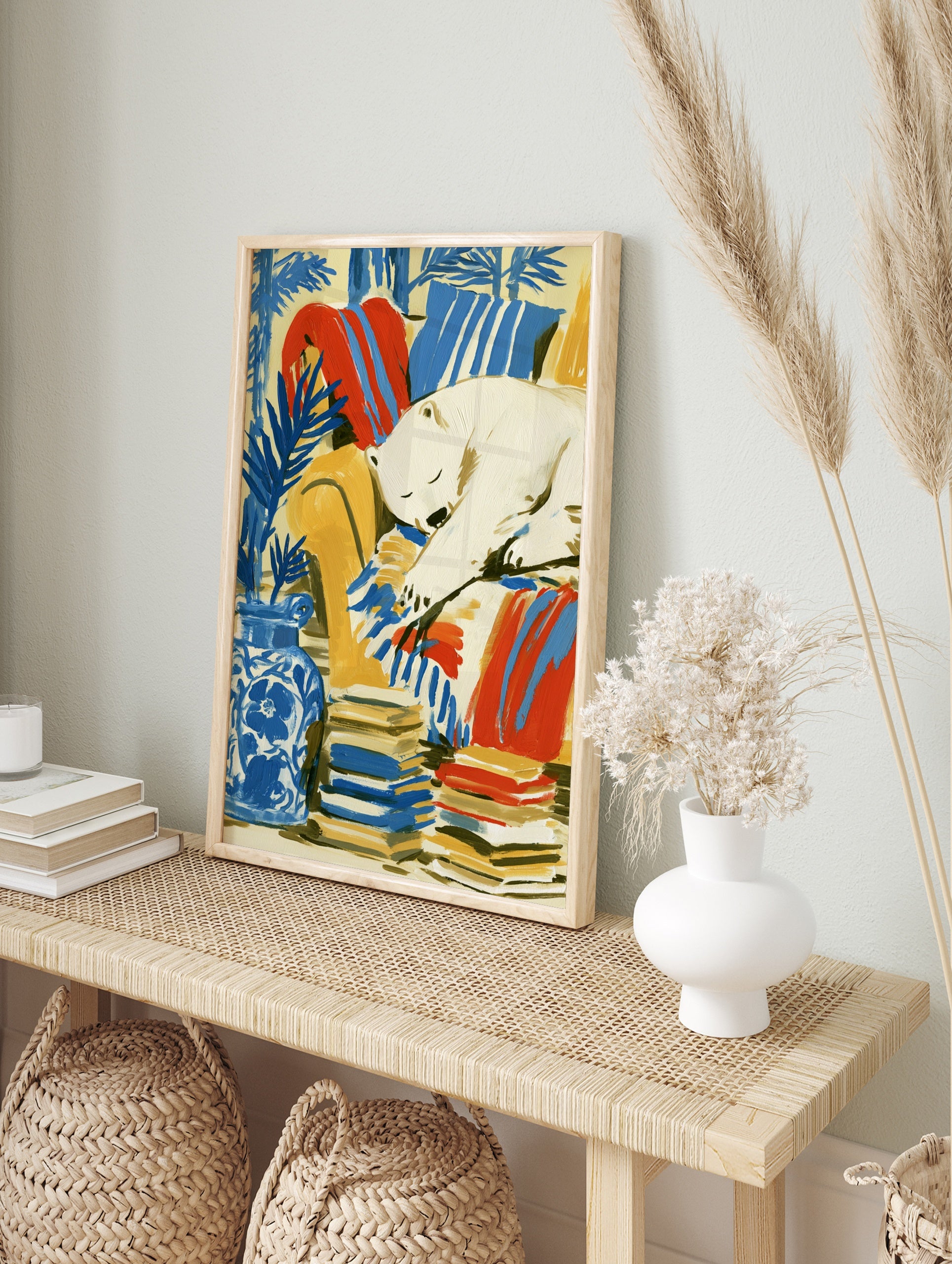 Illustrative art print of a sleeping polar bear on a yellow armchair with blue botanical, in an alternate framed mockup
