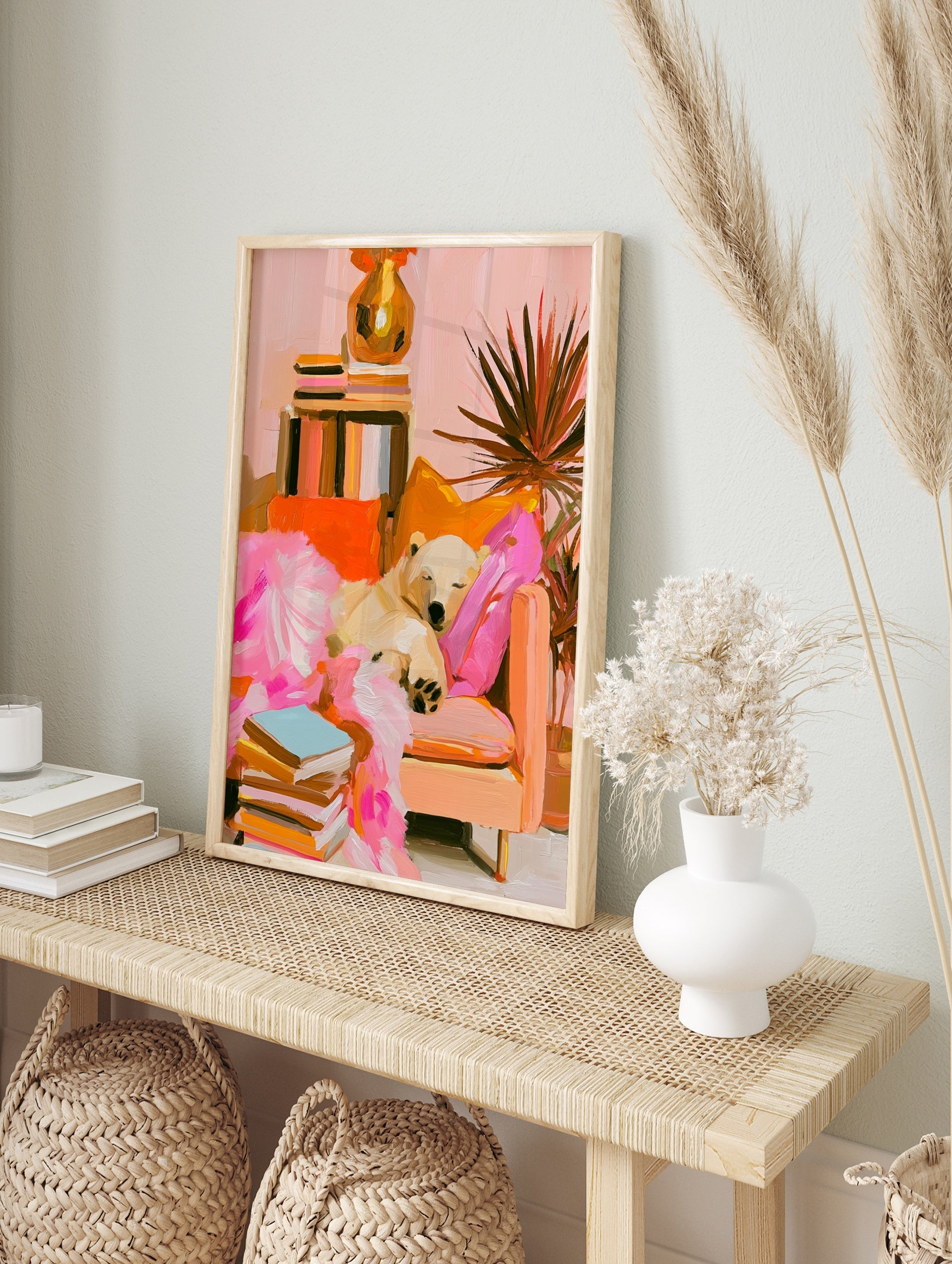 Impressionist style polar bear sleeping on a sofa with books and a houseplant, featuring pink, in an alternate framed mockup