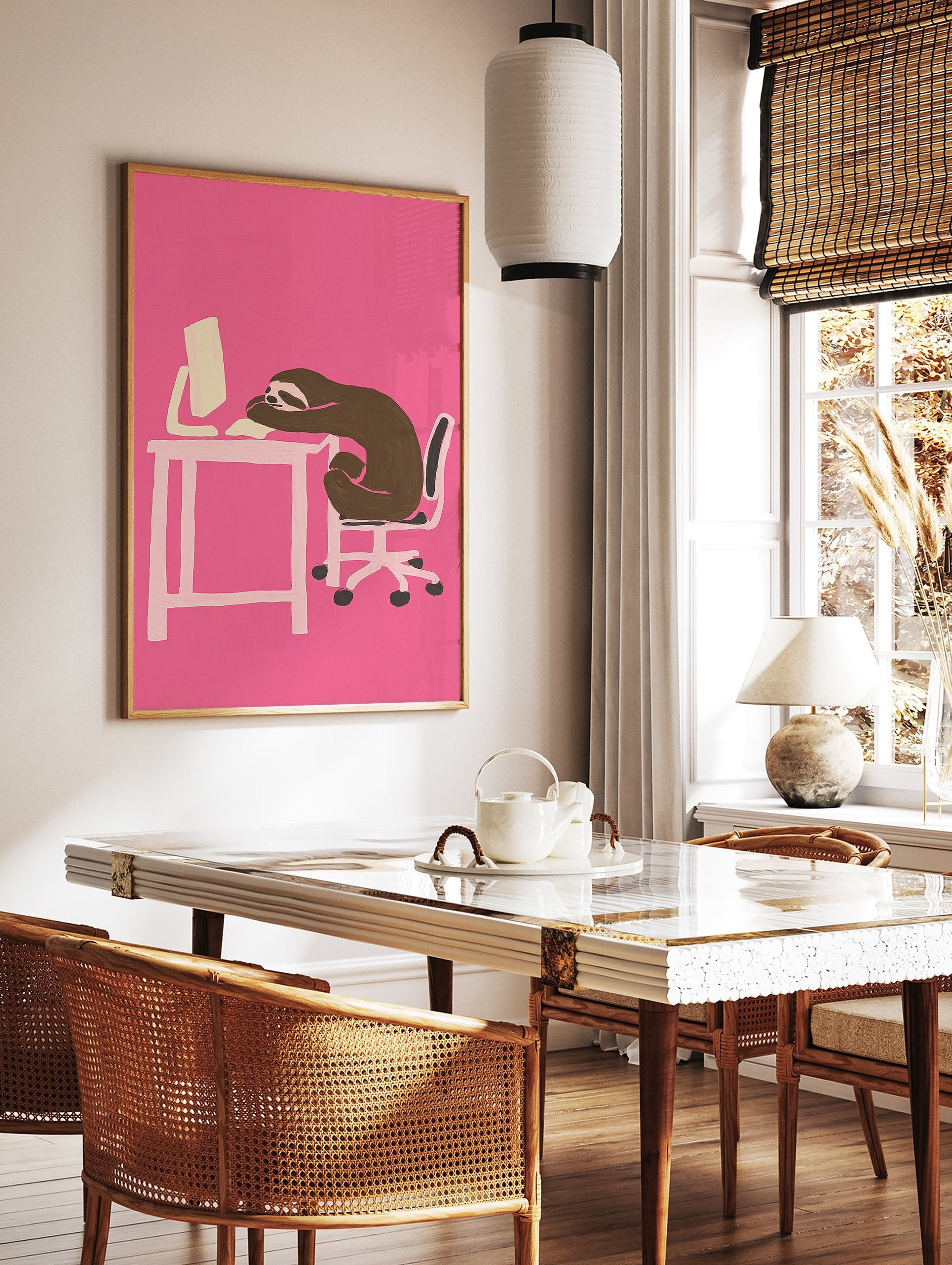 Humorous sloth wall art illustration of a brown sloth sleeping on a desk with a computer against a vibrant pink background. - Image 2