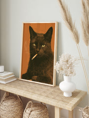 Black cat smoking a cigarette illustration against an orange background, illustrative animal, in an alternate framed mockup