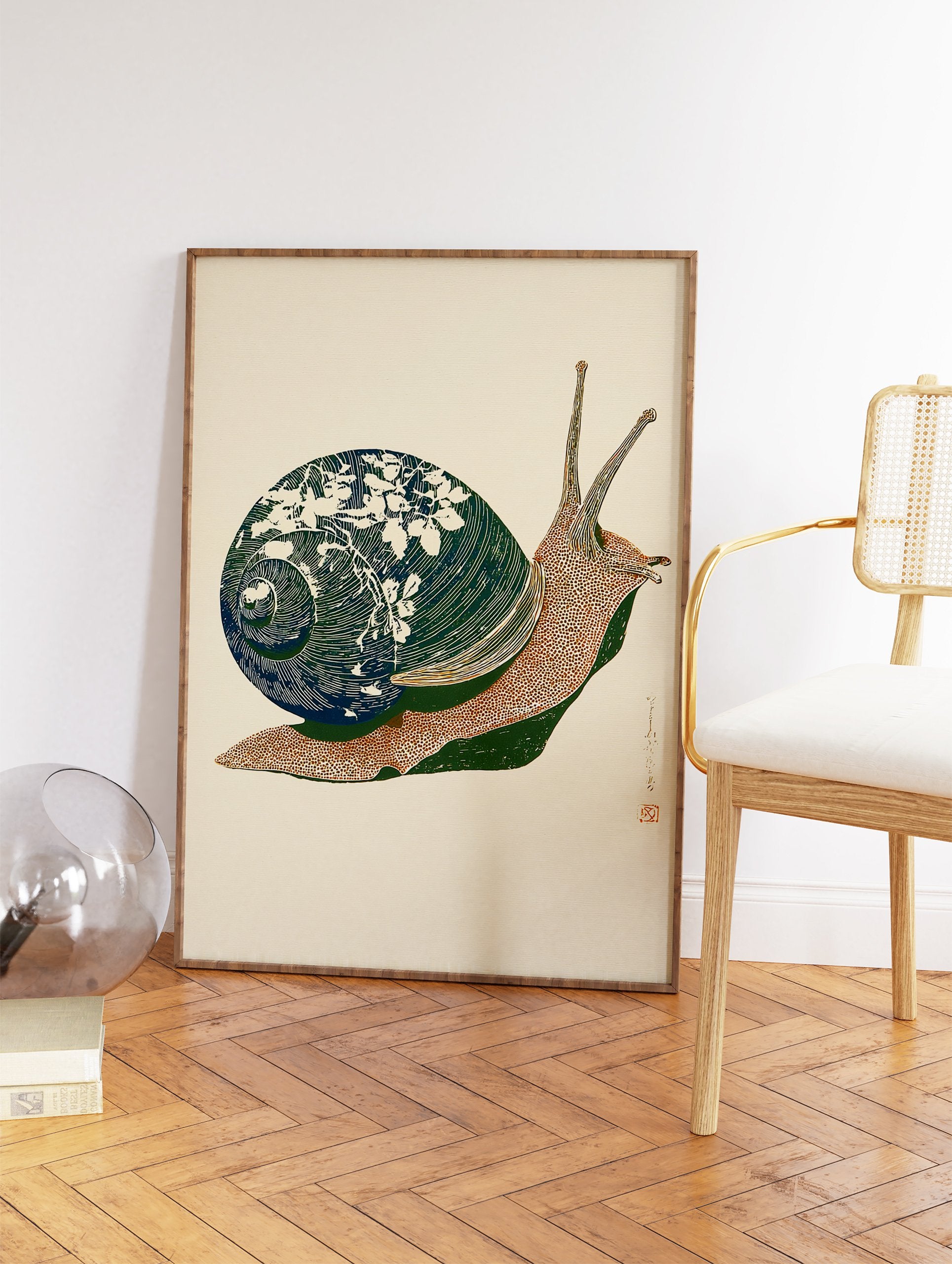 Stylized snail art print with a dark teal botanical shell and brown body, depicted in a woodblock style on a cream background. - Image 2