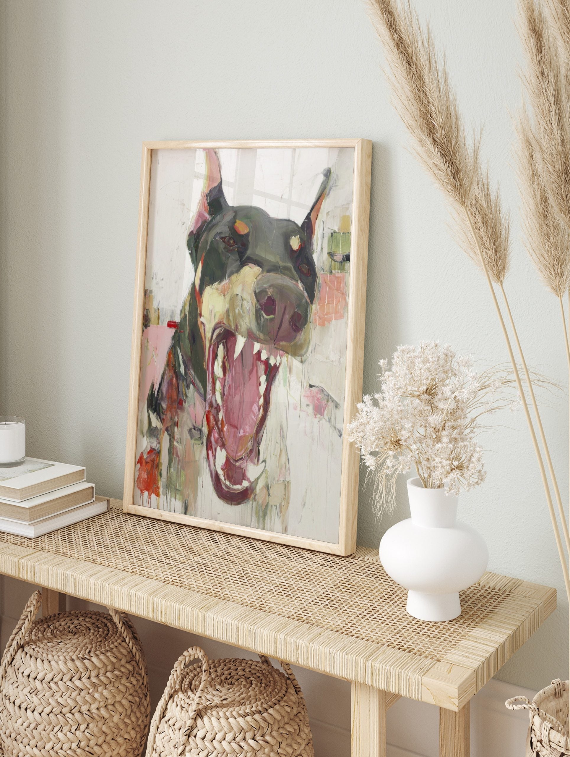 Expressive painting of a snarling Doberman dog with open mouth and bared teeth on a white, in an alternate framed mockup