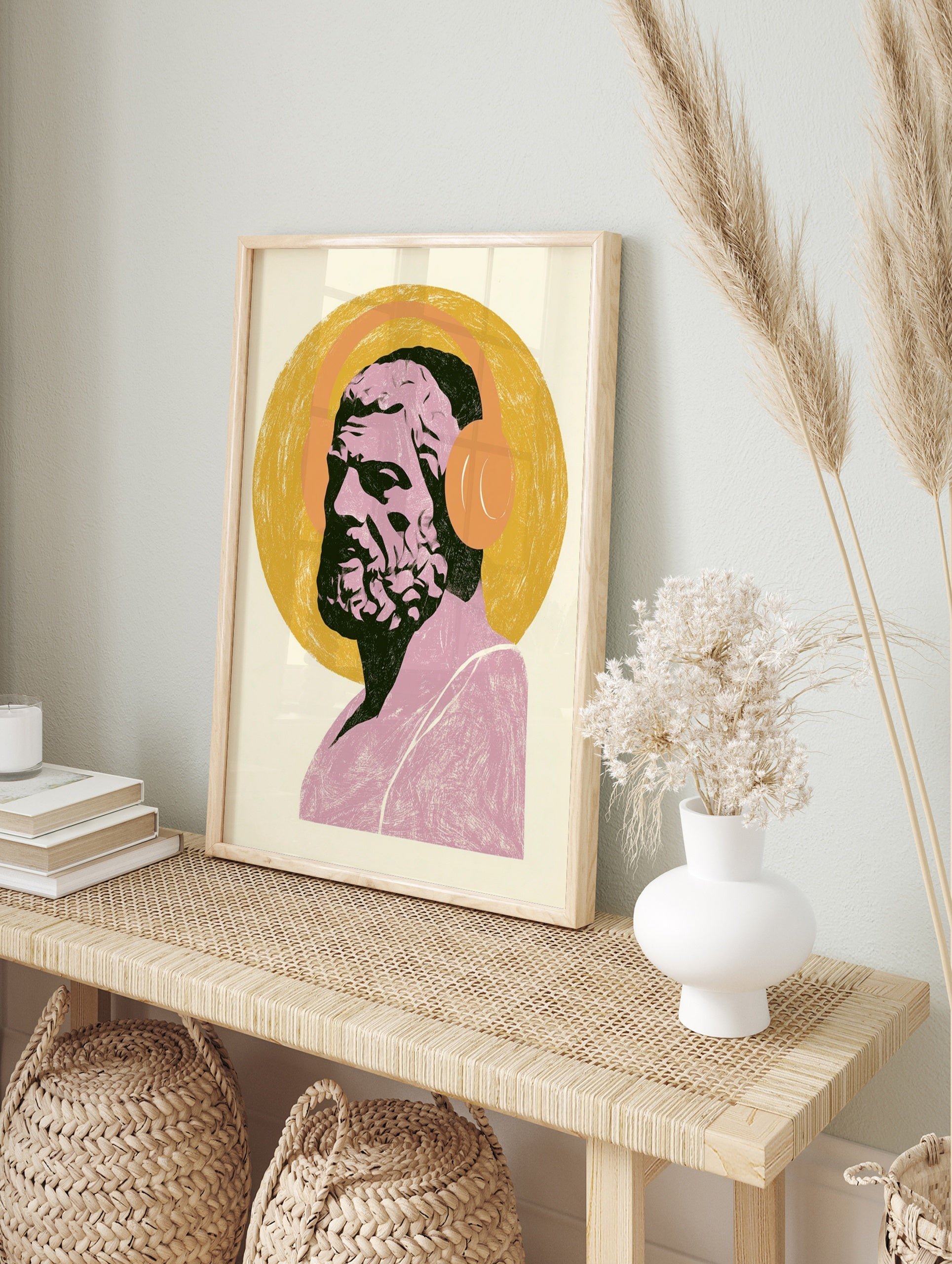 Classical bust of Socrates wearing orange over-ear headphones on a yellow circular background, in an alternate framed mockup