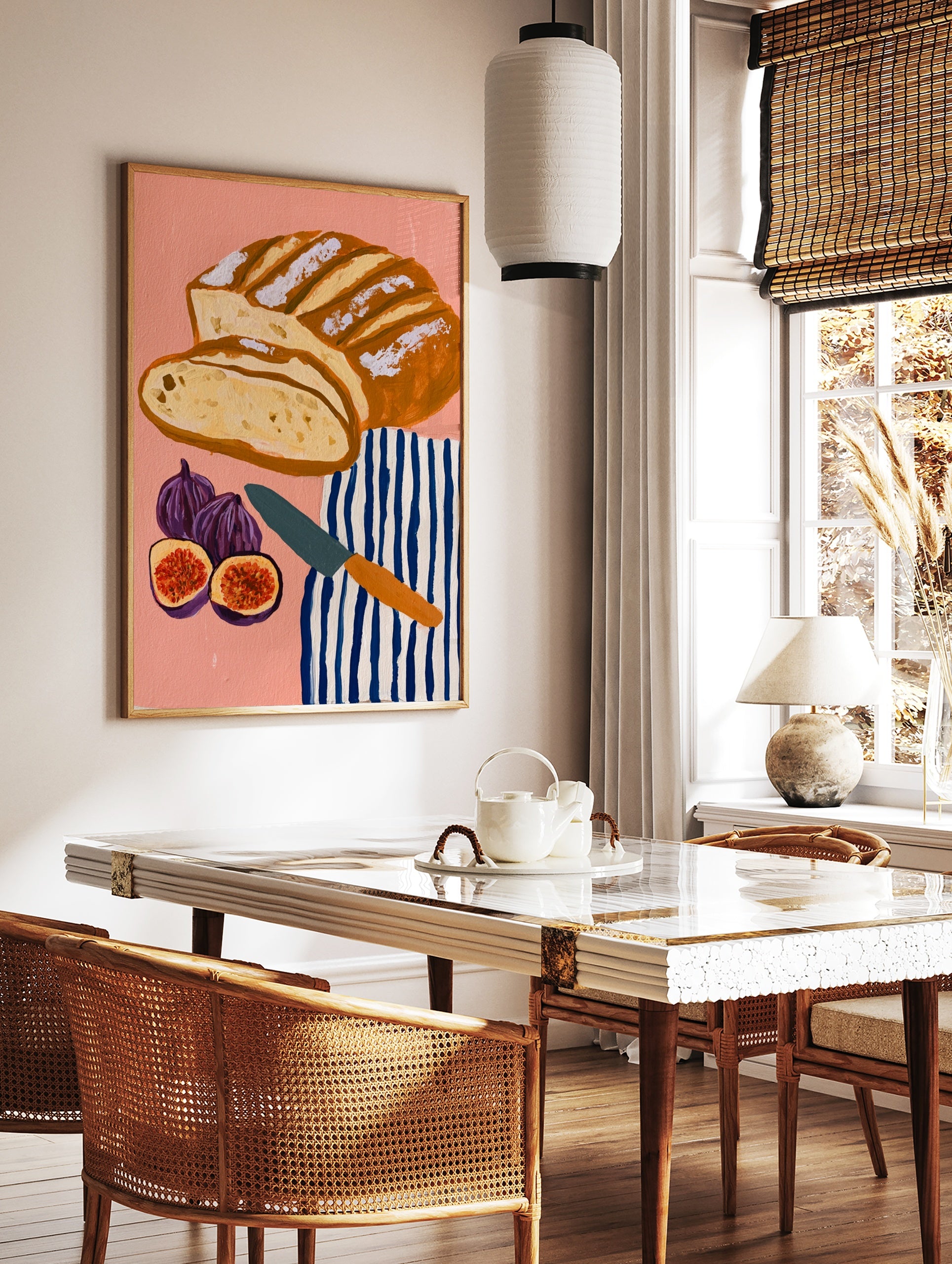 Illustrative art print of sliced sourdough bread, figs, and a striped tea towel on a pink background, in a styled room mockup