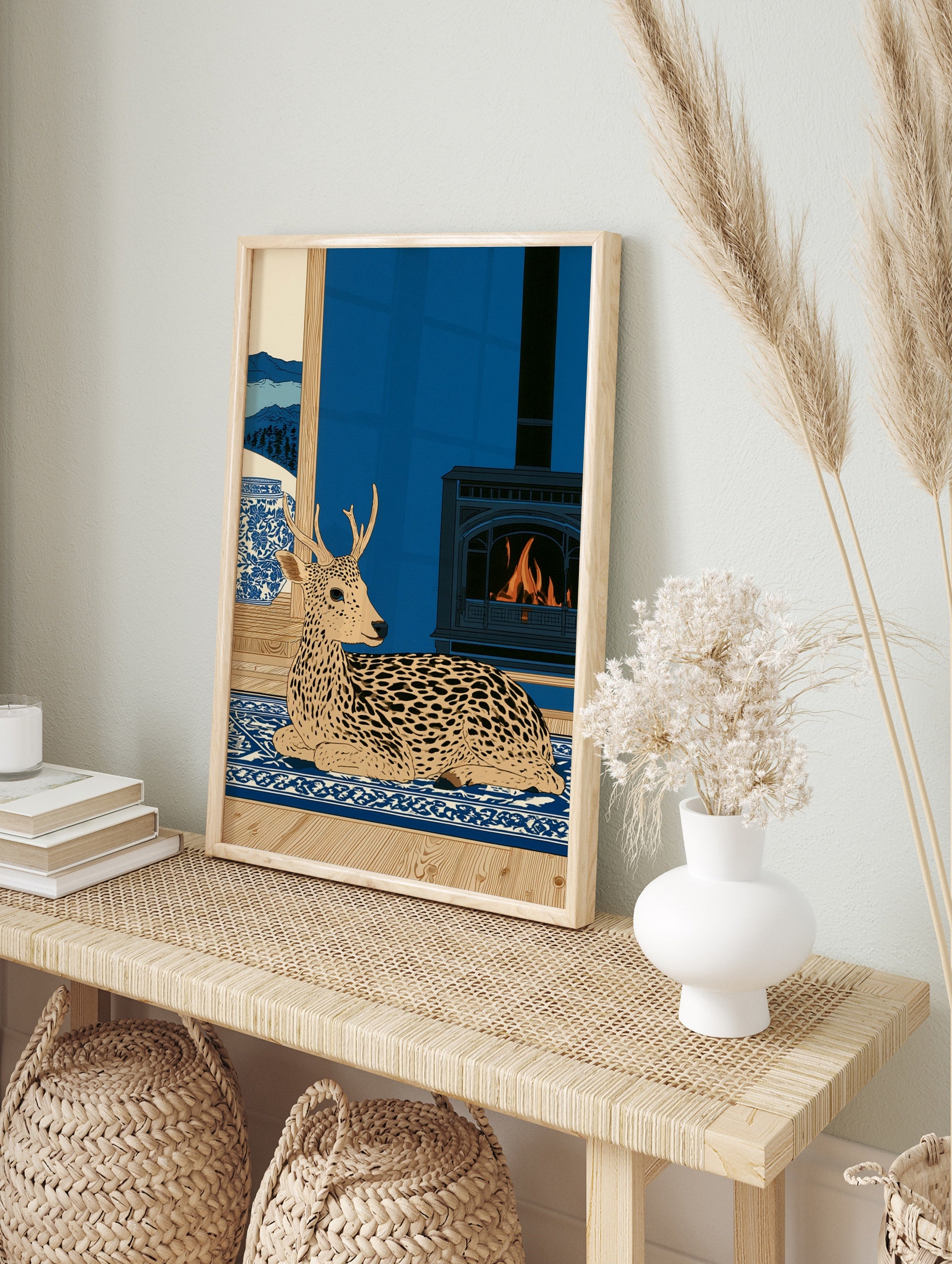 Spotted deer illustration on blue rug with fireplace and snowy mountain window view in a flat, in an alternate framed mockup