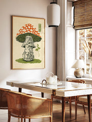 Japanese woodblock print of a red and white spotted mushroom with green gills and a stem on grass, in a styled room mockup