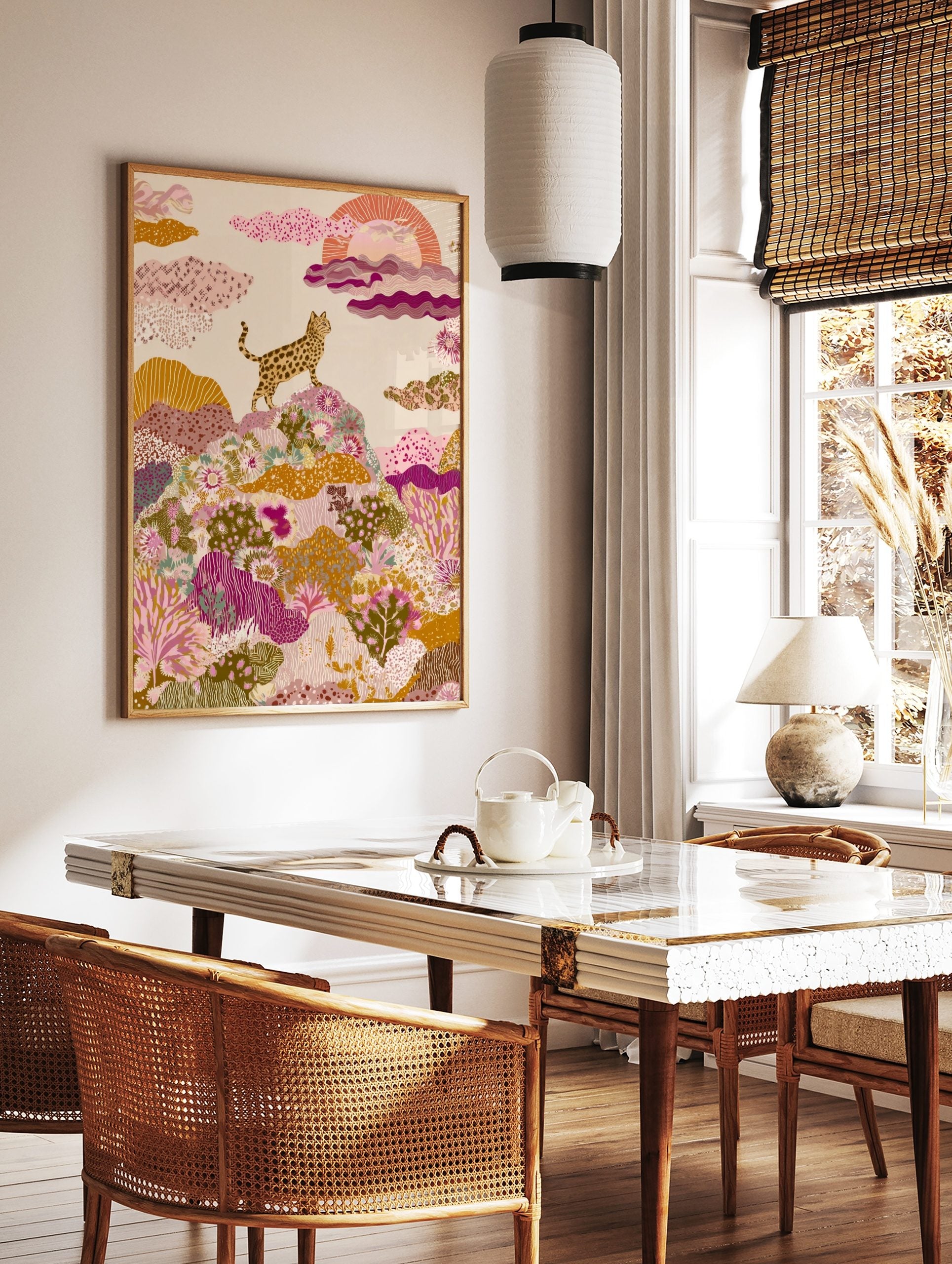 Spotted wild cat on a hill with colourful patterned plants and stylized sun, illustrative art print, in a styled room mockup