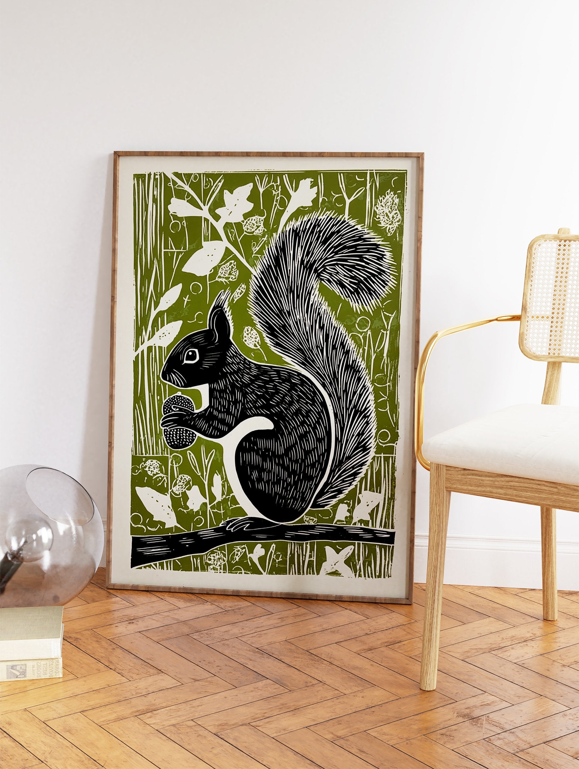 Black squirrel linocut art print on a green background, holding an acorn while sitting on a branch, woodland animal decor. - Image 2