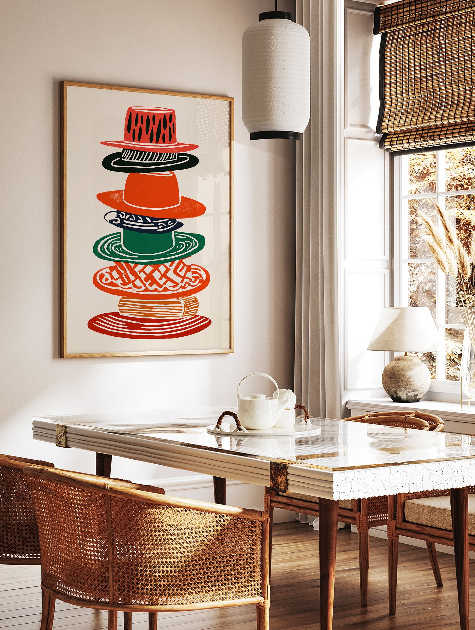 Multi-color stacked hats wall art illustration with various patterns in red, green, black, and orange on a cream background. - Image 2