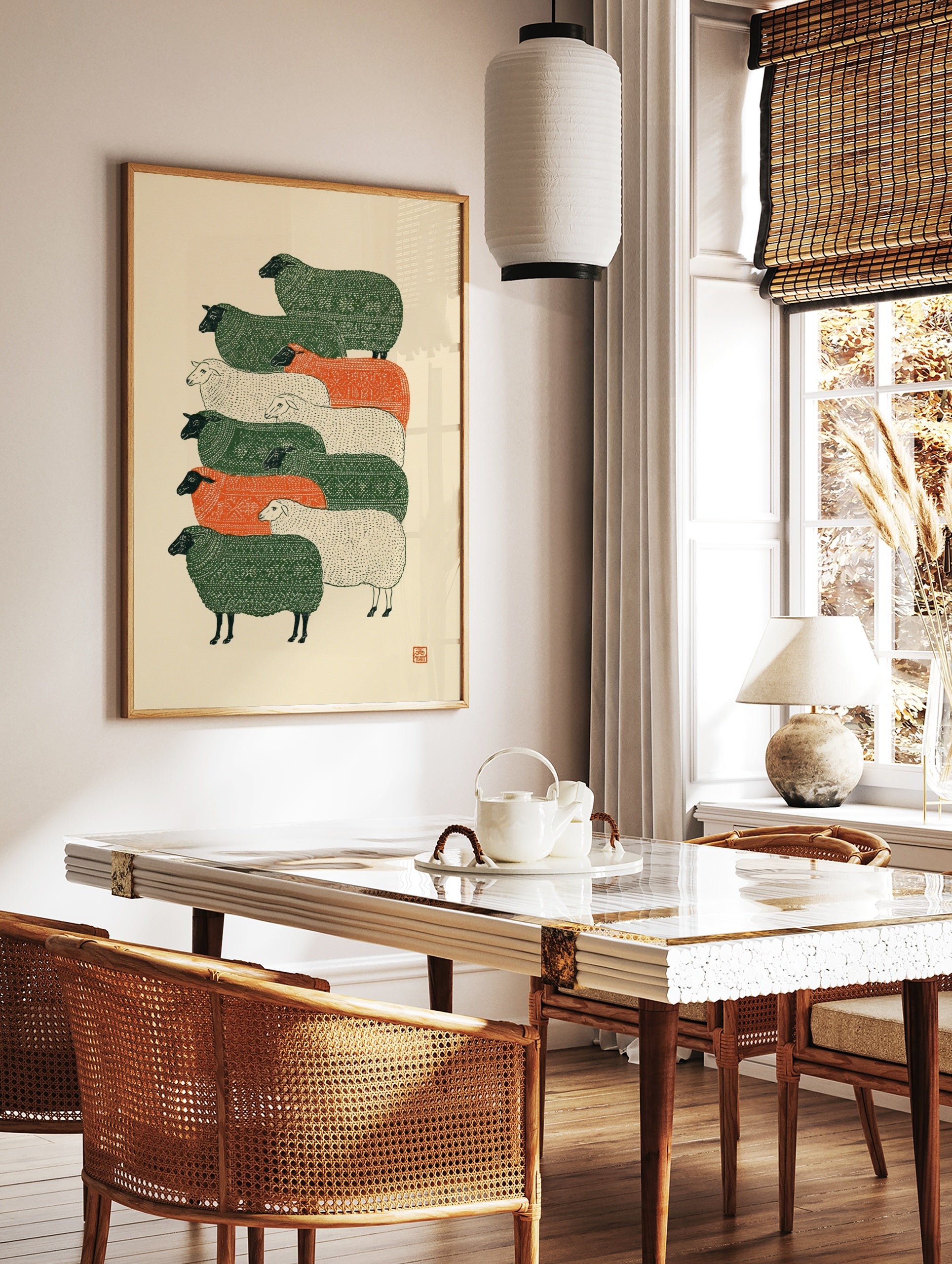 Stylised stacked sheep illustration with green, orange, and cream textured patterns on a cream, in a styled room mockup