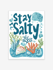 Stay Salty typography print with blue text, orange coral, green seaweed, and seashells on a white background
