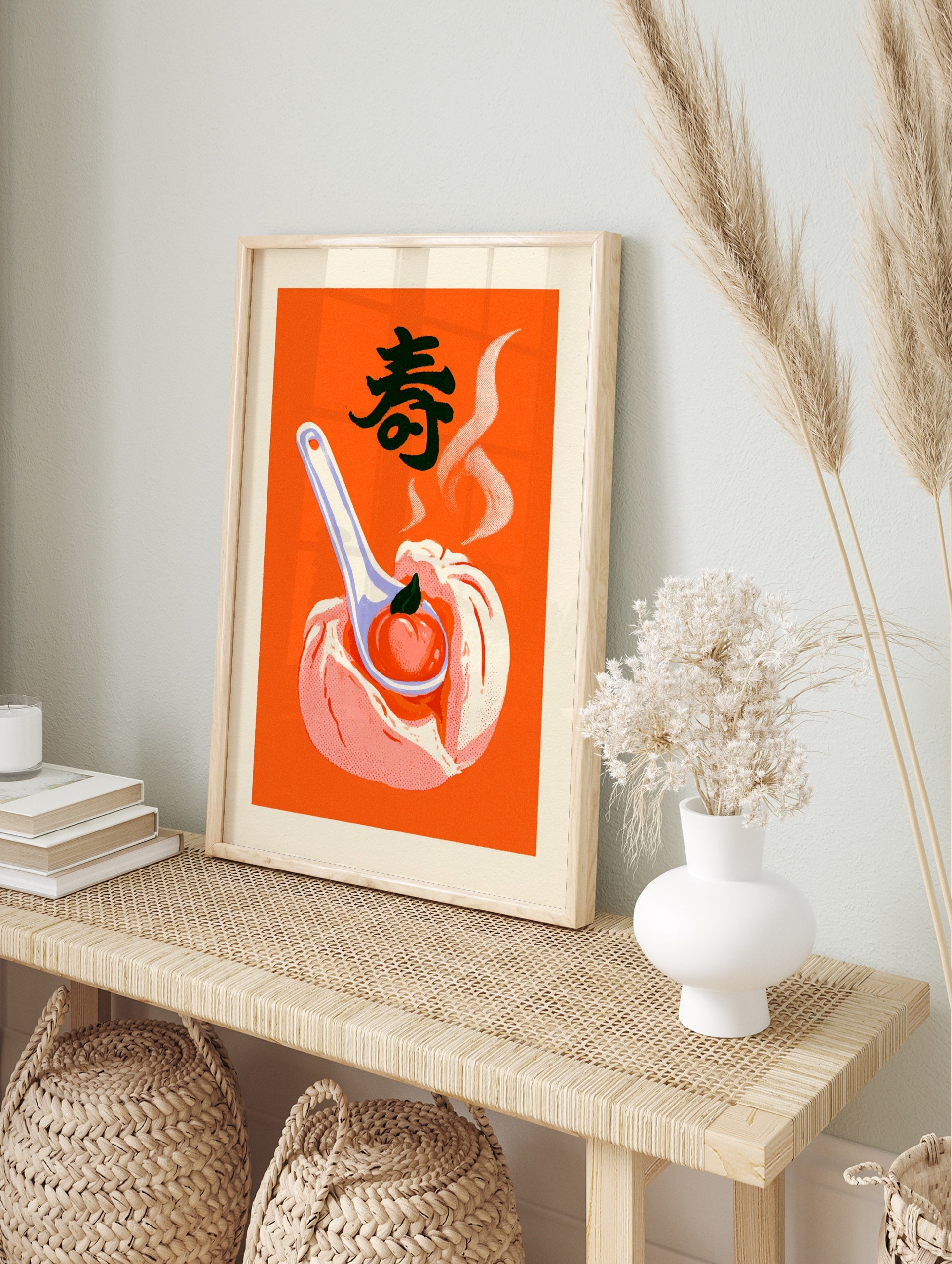 Steamed bun with peach on a spoon illustration, featuring the kanji for longevity, on a bold, in an alternate framed mockup
