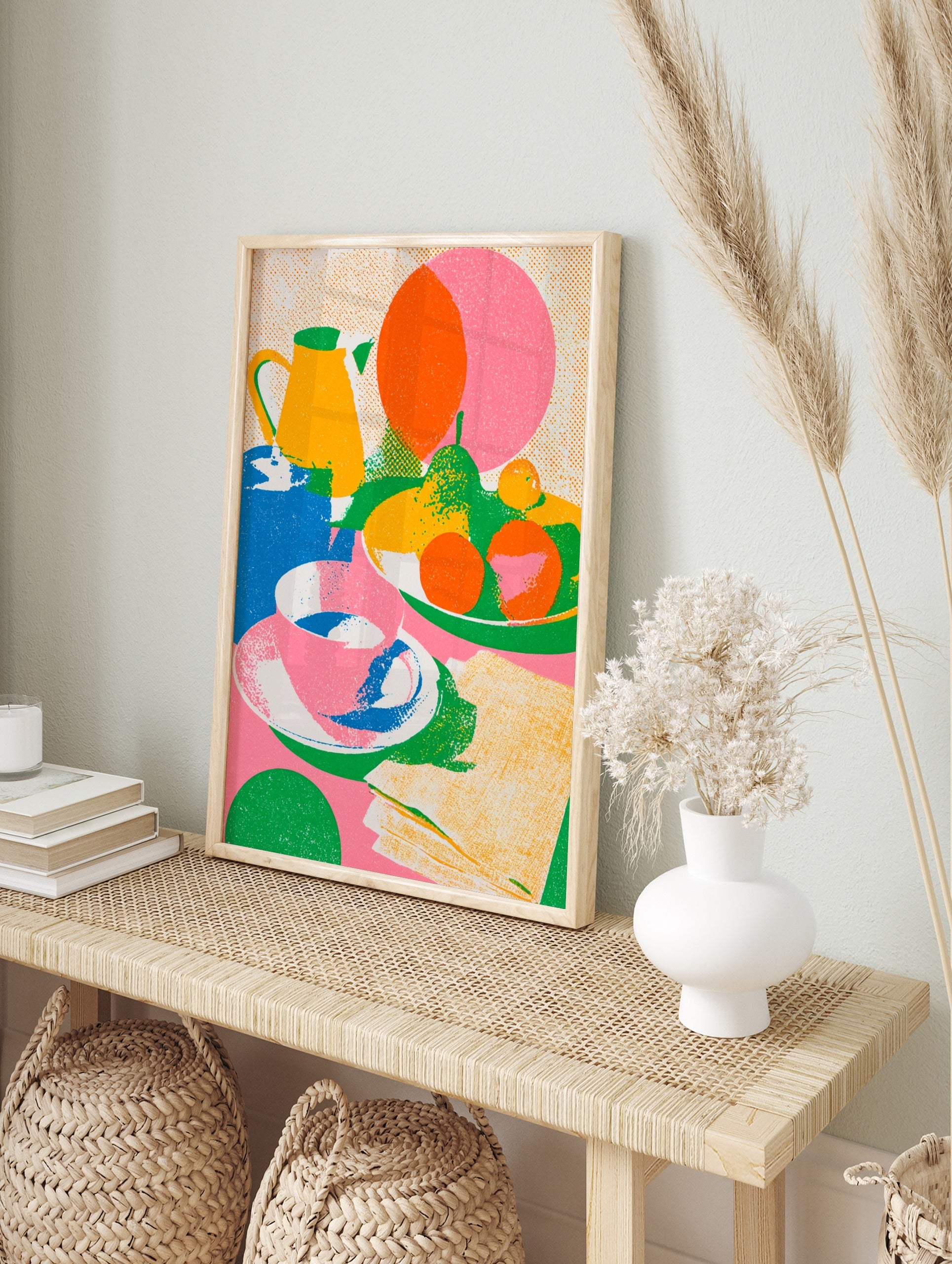 Colourful still life illustration with a yellow jug, bowl of fruit, and tea cup, featuring a, in an alternate framed mockup