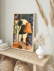Watercolor painting of a lamp and sunflower vase on a table with blue curtains and a, in an alternate framed mockup