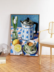 Still life painting of white tulips, a blue and white teapot, lemons, and a teacup on a checkered tablecloth. - Image 2
