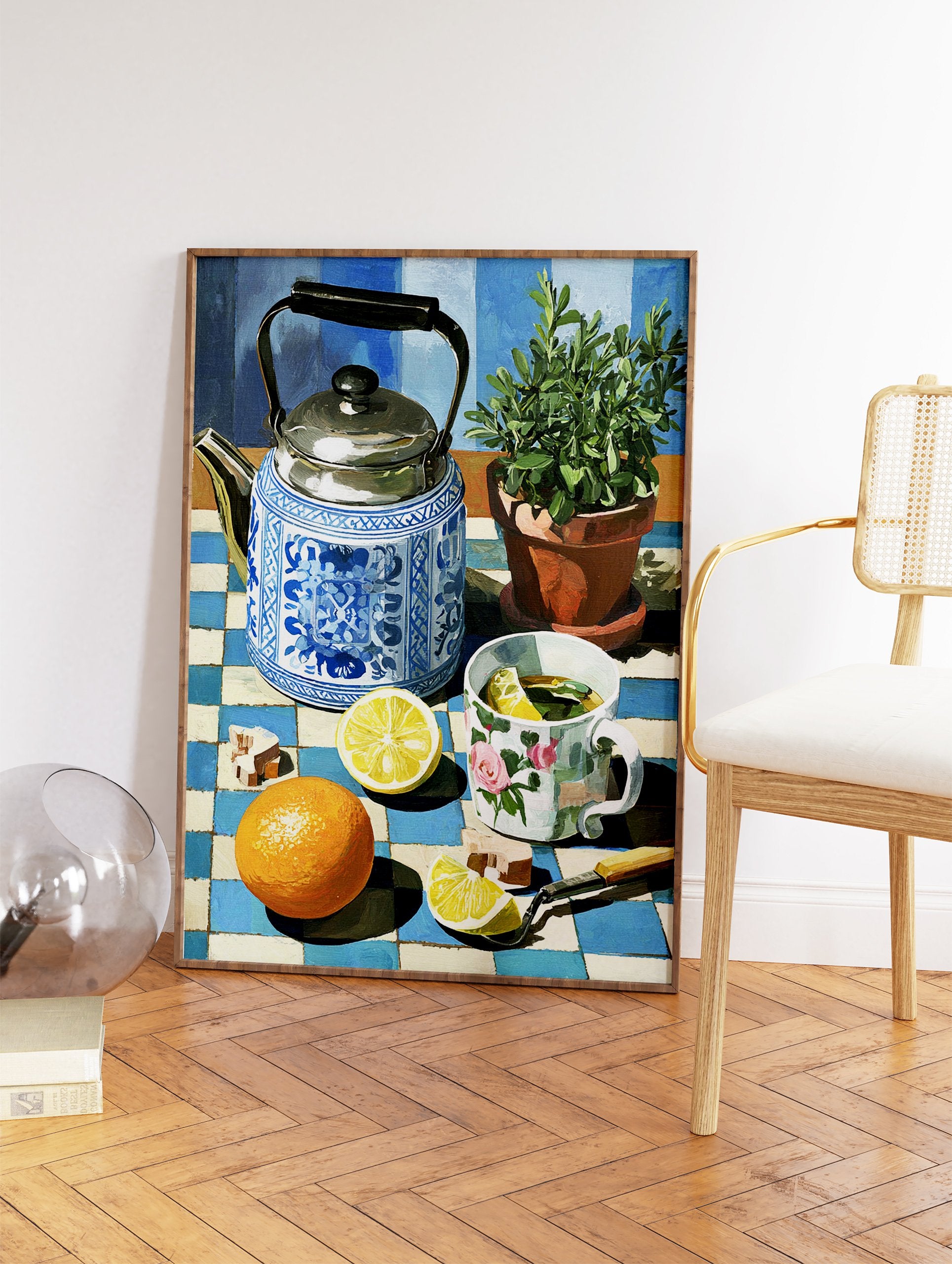 Still life painting of a blue and white teapot, lemon tea, orange, and plant on a checkered tablecloth, vibrant kitchen wall art. - Image 2