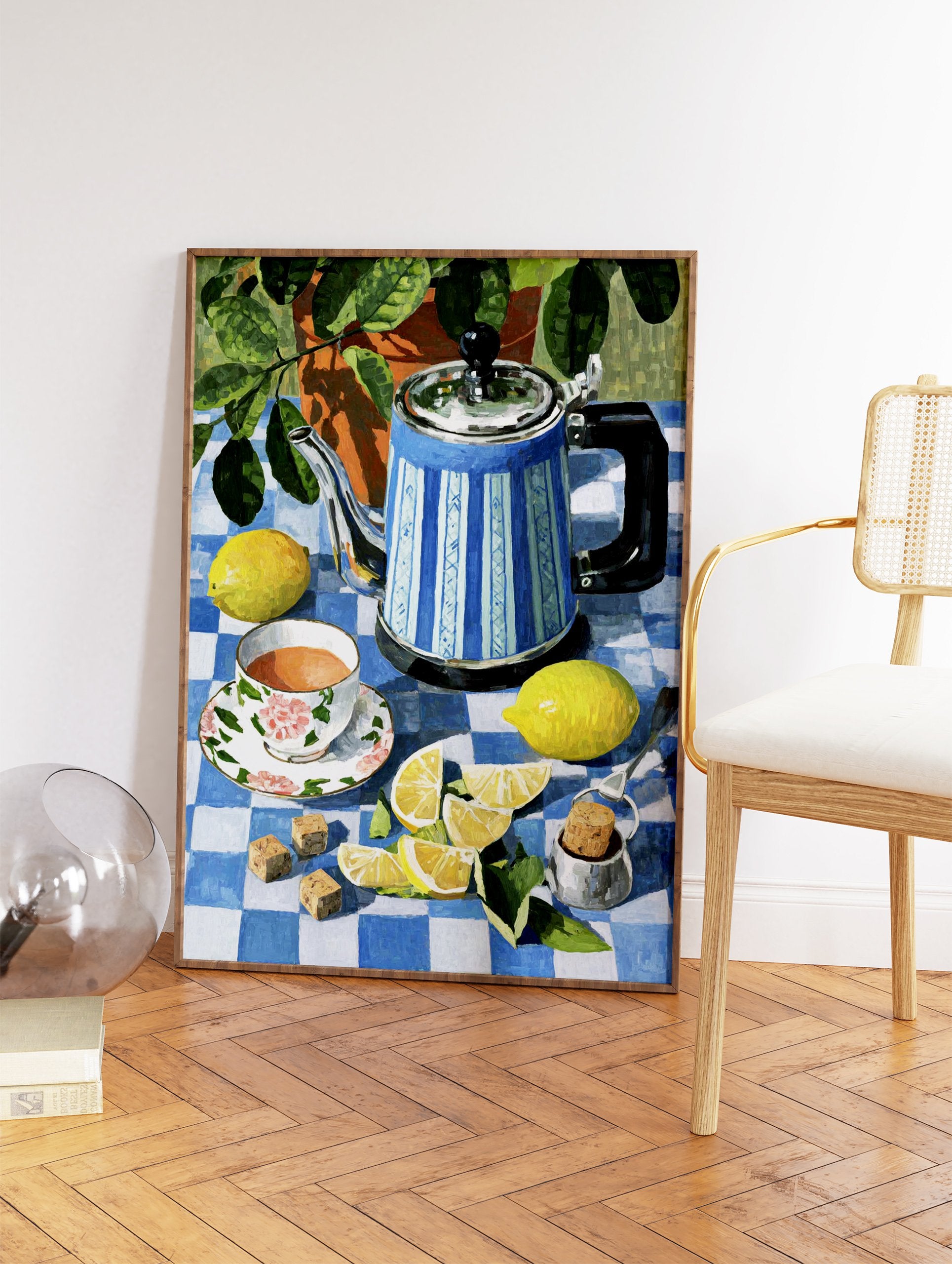 Still life painting of a blue striped teapot, floral teacup, and fresh lemons on a blue and white checkered tablecloth. - Image 2