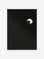 Stippled eyeball art print with a black pupil and light sclera on a speckled black background, portrait orientation