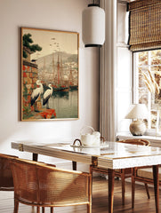 Japanese woodblock style print of white storks overlooking a harbour with ships and a mountain, in a styled room mockup
