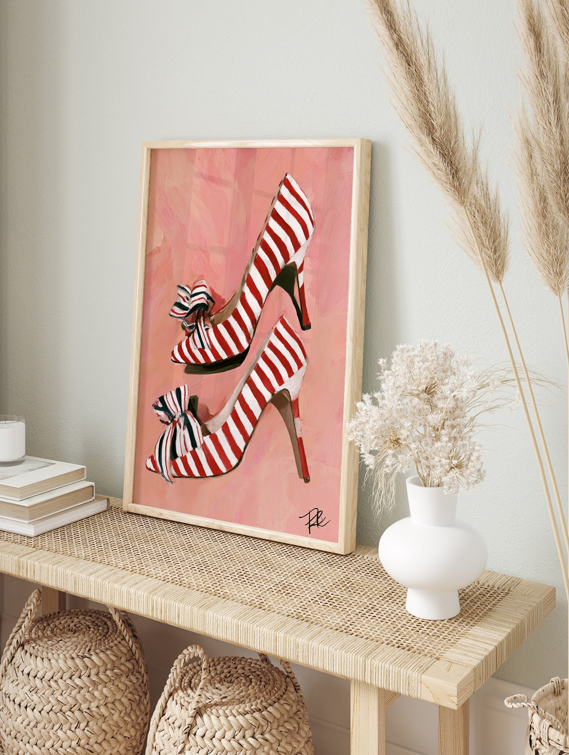 Red and white striped high heel shoes illustration with bows on a pink background art print, in an alternate framed mockup