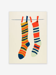 Illustrative art print of two striped socks hanging on a laundry line against a cream background