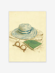 Illustrative print of a blue and white striped straw hat, green book, and eyeglasses on a light background