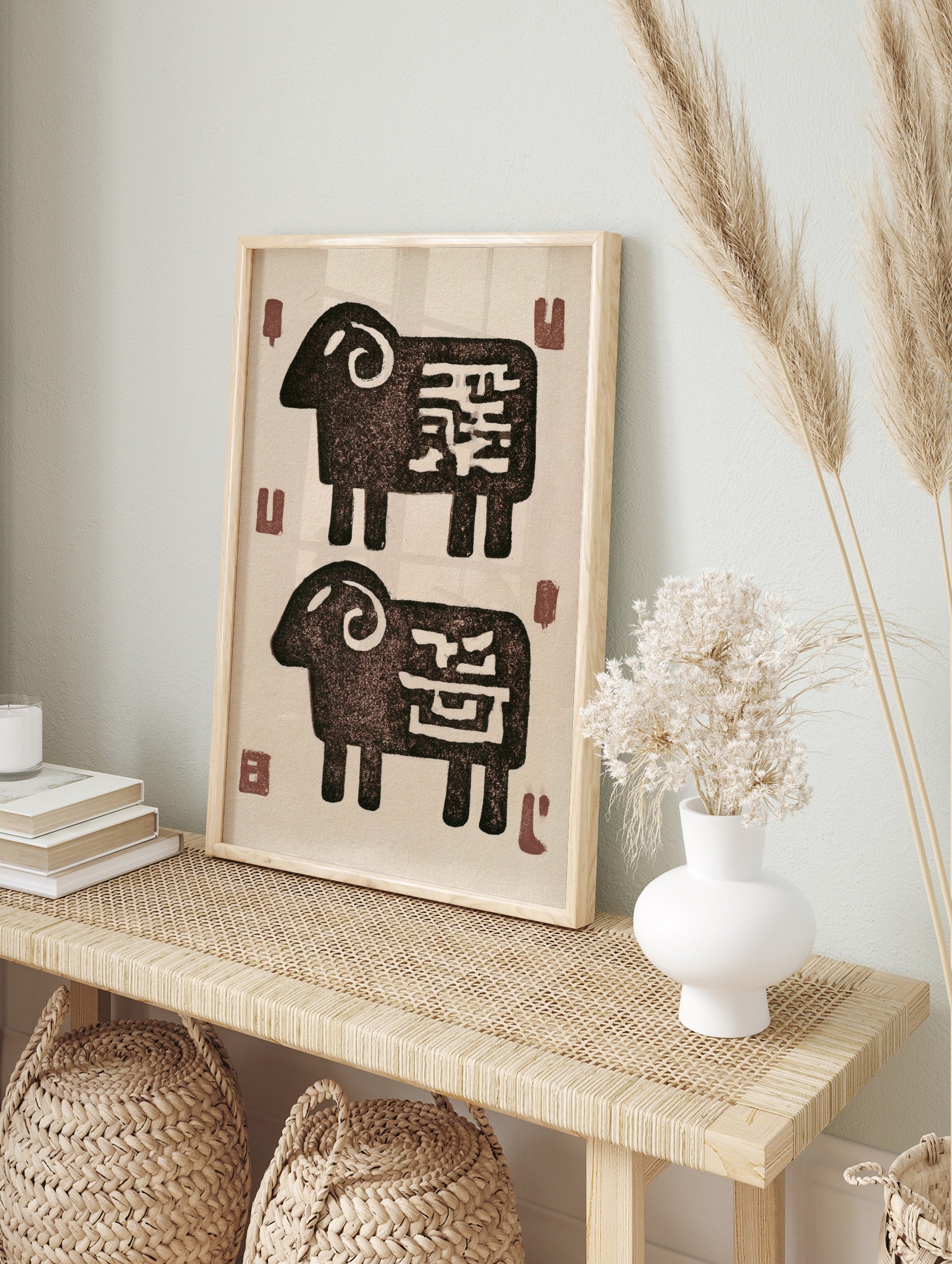 Stylised ram animal illustration with abstract markings on a cream background, in an alternate framed mockup