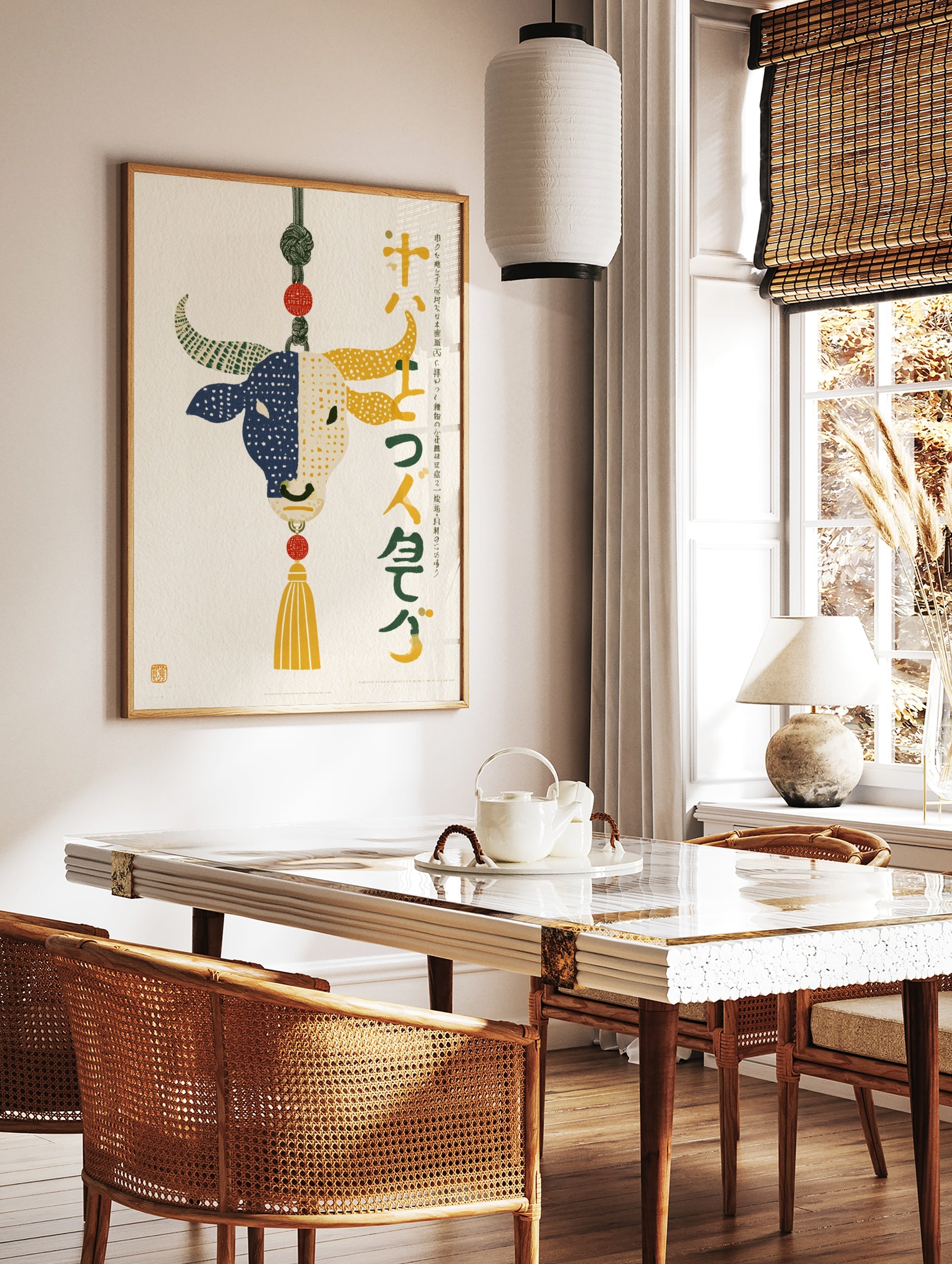 Stylised bull illustration with split blue and yellow dotted design, decorative knot, and Japanese, in a styled room mockup