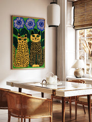 Stylised illustration of two spotted cats sitting beside large blue flowers against a vibrant green, in a styled room mockup