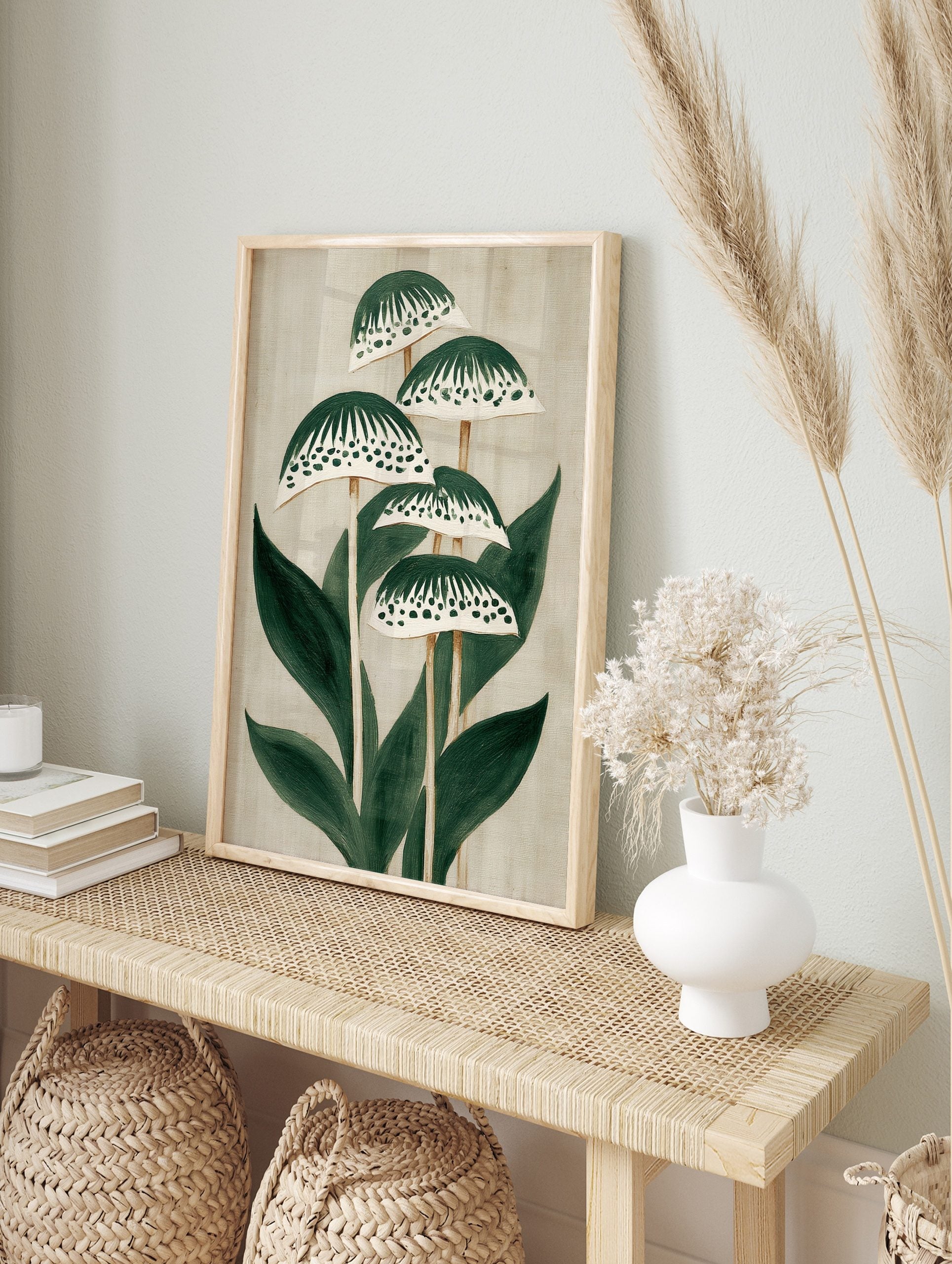 Stylised green plant botanical illustration with patterned caps and leaves on a light beige, in an alternate framed mockup