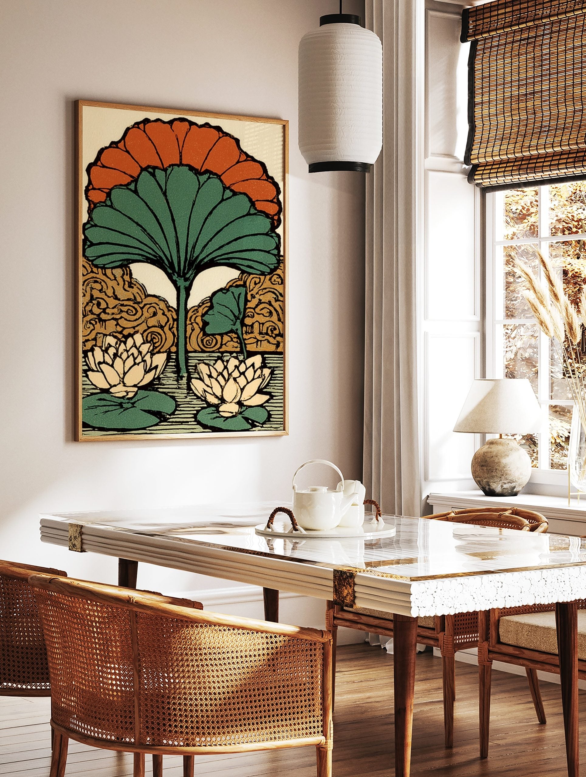 Stylised lotus flower art print with large green fan leaf, orange petals, and two water lilies on, in a styled room mockup