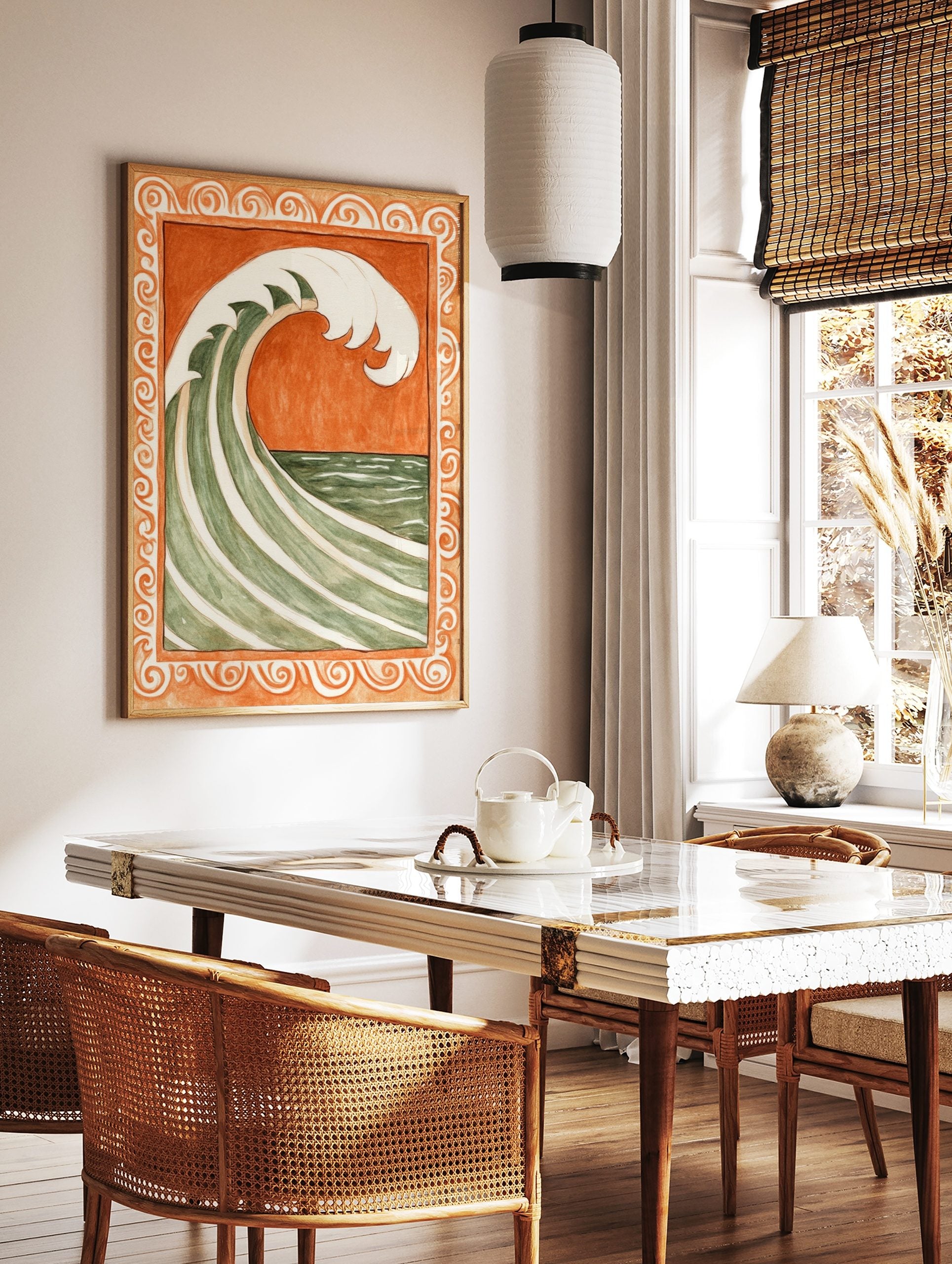Stylised green and white ocean wave against burnt orange background, within ornate scrollwork border, in a styled room mockup
