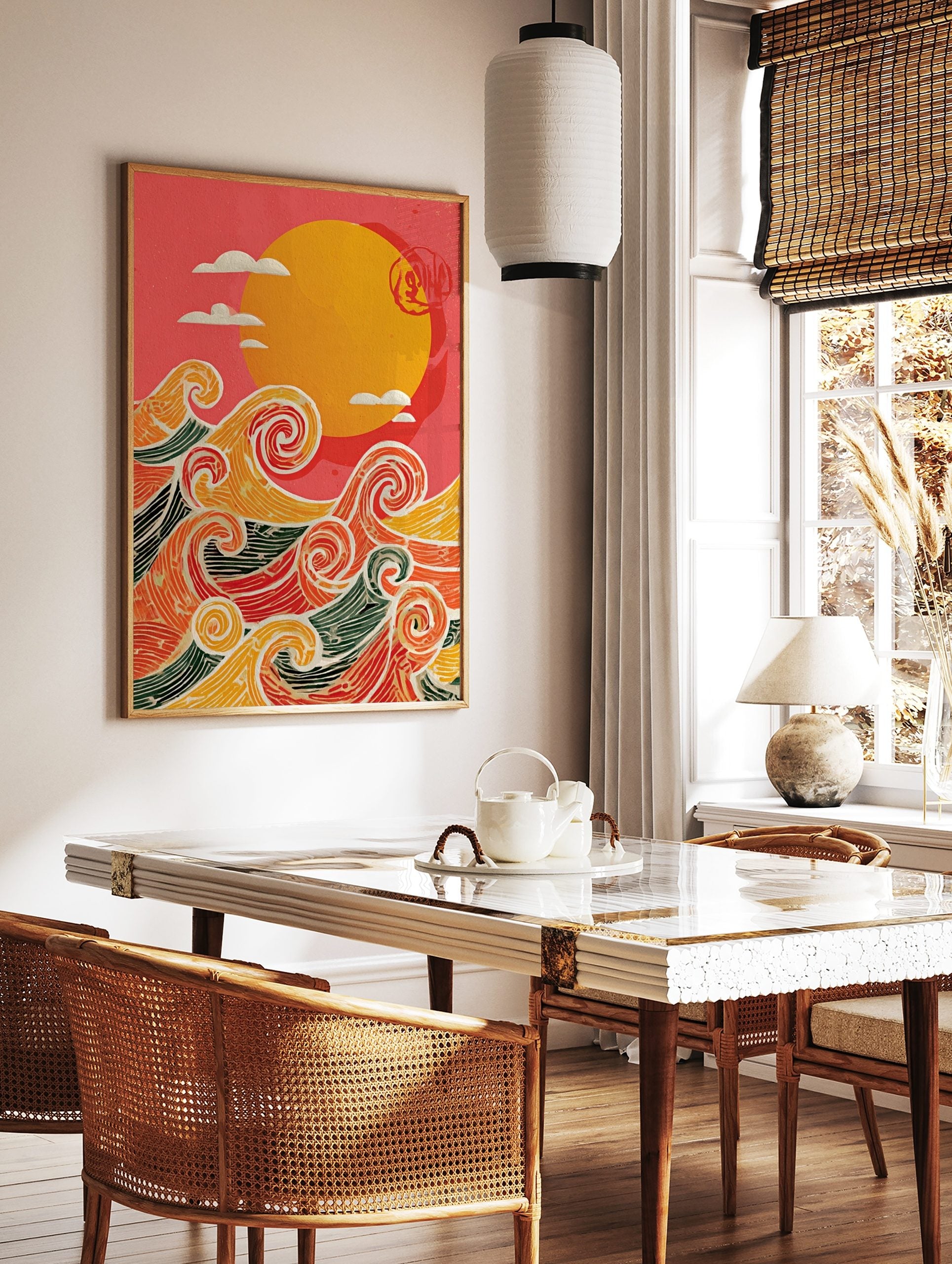 Stylised ocean waves in orange, red, yellow, green with white outlines, beneath a yellow sun and, in a styled room mockup