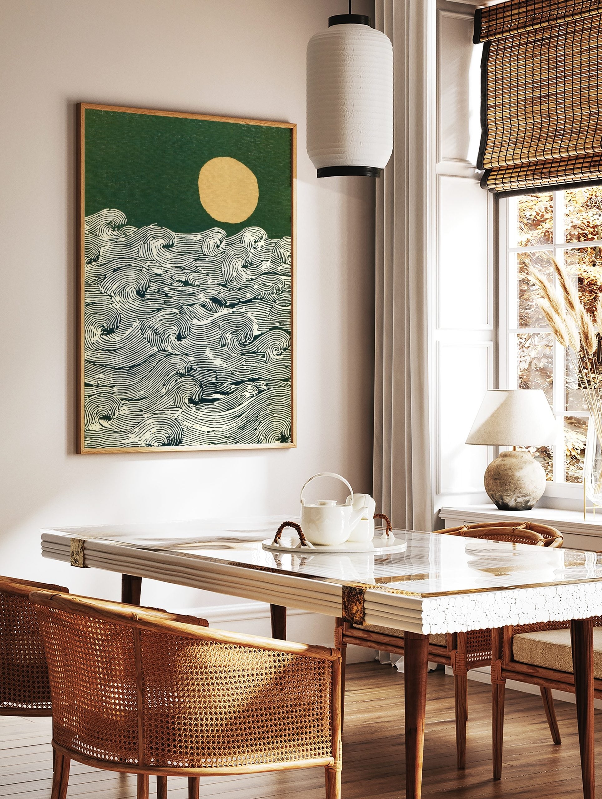 Stylised ocean waves with detailed lines, a pale yellow moon, and a dark green sky art print, in a styled room mockup