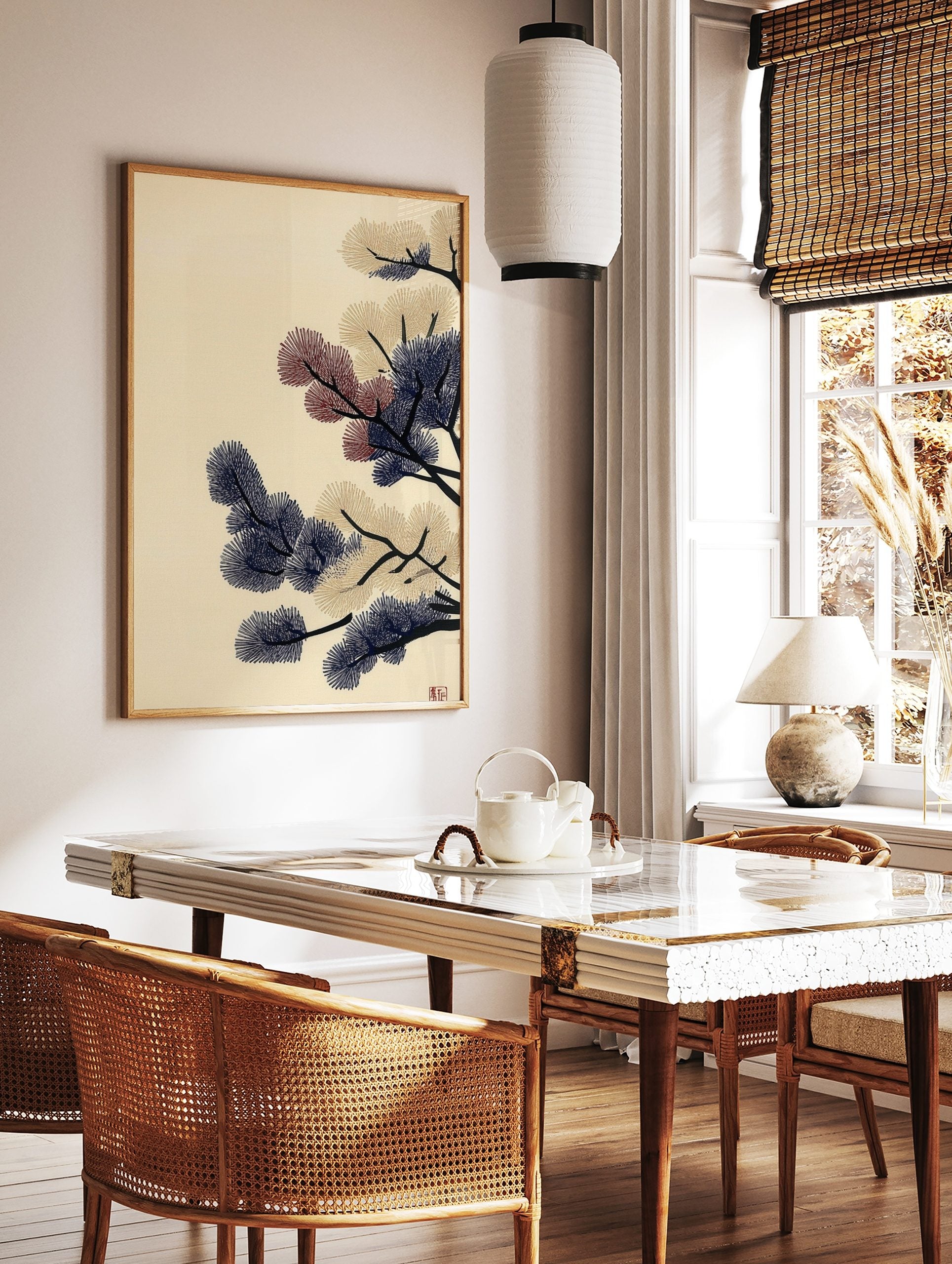 Stylised pine branches with navy blue, beige, and red needle clusters on a cream background, in a styled room mockup