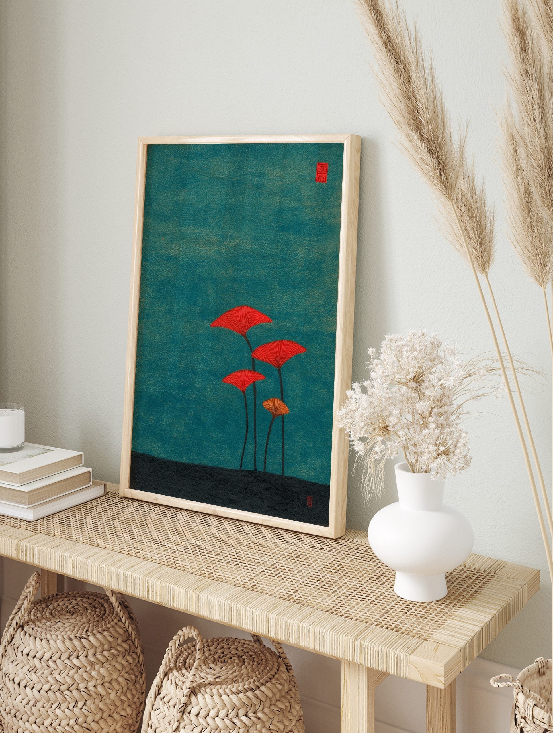 Stylised red and orange fan-shaped mushrooms on long stems against a textured teal background, in an alternate framed mockup