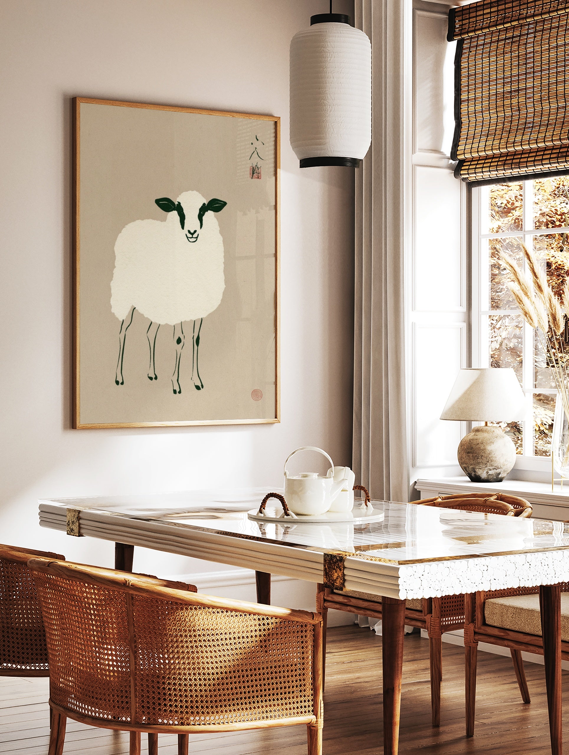 Minimalist illustrative sheep art print with black and white details on a beige background, in a styled room mockup