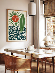 Stylised terracotta sun with green rays, green surfboard, and dark teal waves on a cream background, in a styled room mockup