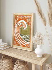 Stylised ocean wave art print with orange and white stripes, olive green sea, and ornate Art, in an alternate framed mockup