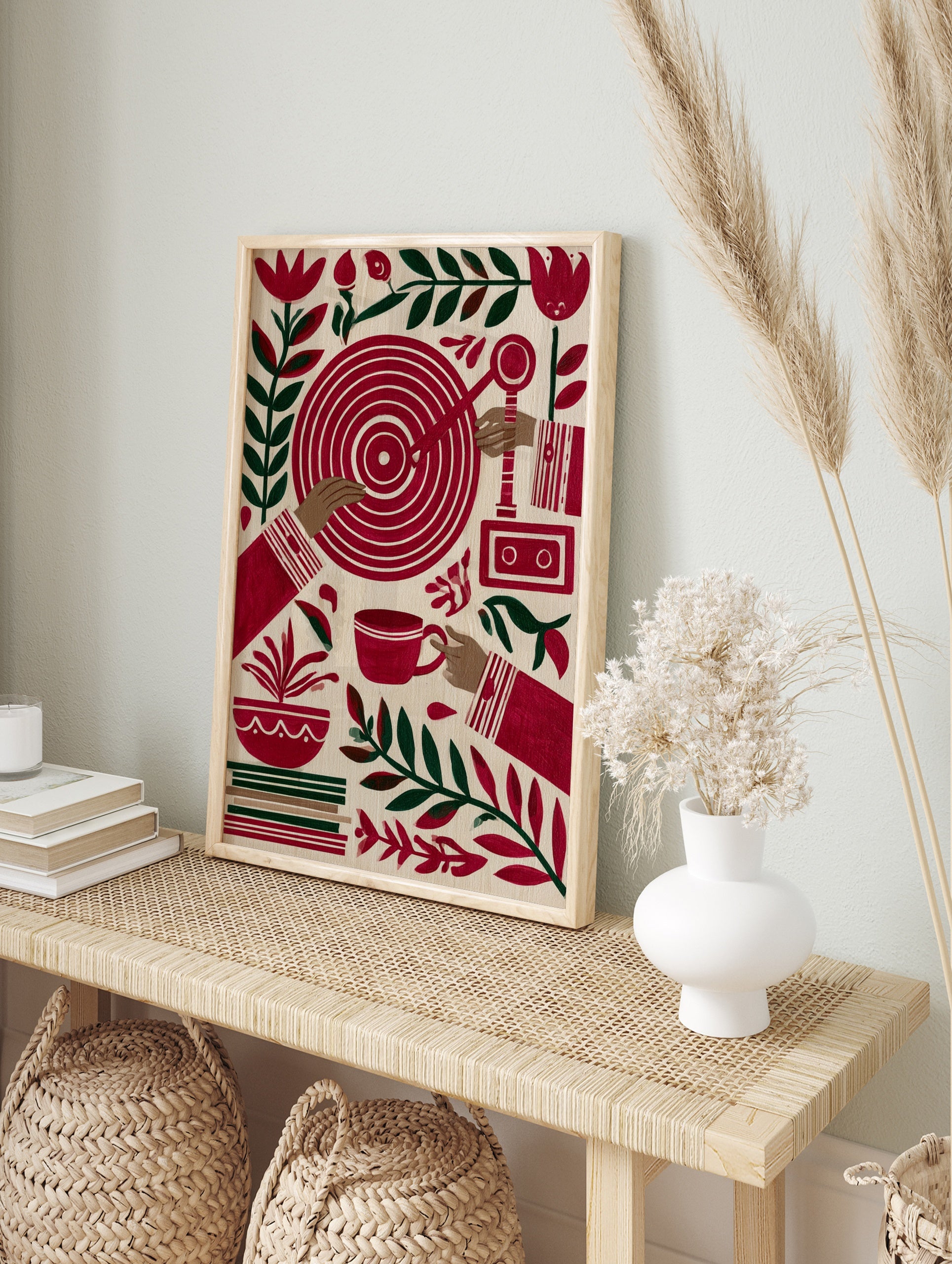 Stylized folk art print featuring hands, a red target, cassette recorder, teacup, and, in an alternate framed mockup