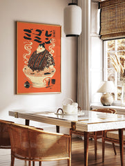 Illustrative print of a sumo wrestler in a ramen bowl with steam, Japanese text, and orange, in a styled room mockup