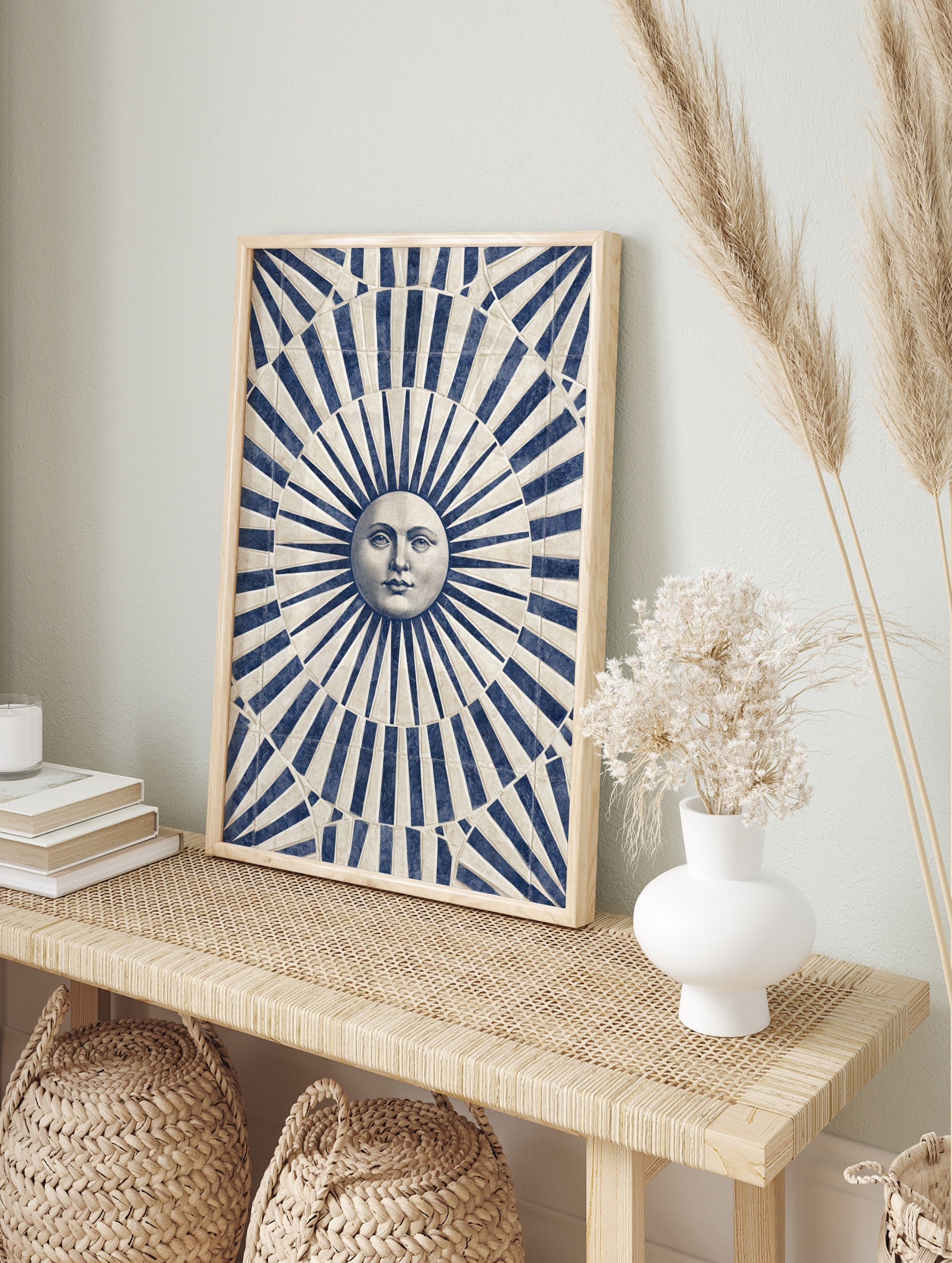 Classical sun face illustration with blue and beige radiating stripes art print, in an alternate framed mockup